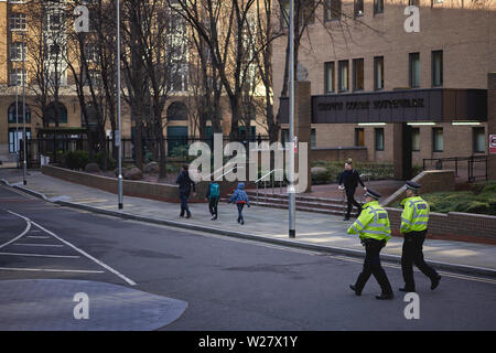 London, UK - February, 2019. Policemen patrolling the streets  in the City, the famous financial district of London. Stock Photo
