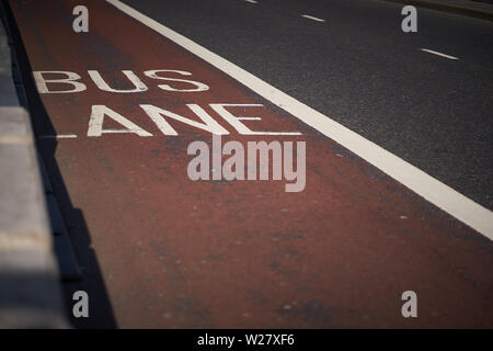 An empty red painted bus lane in central London. Landscape format. Stock Photo