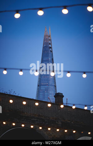 London, UK - February, 2019. View of the Shard with decorative lights on the foreground.