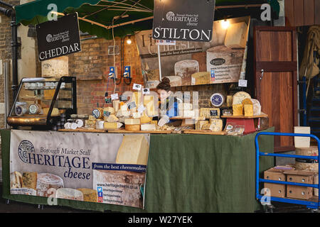 London, UK - April, 2019. Cheese stall in Borough Market, one of the oldest and largest food market in London. Stock Photo