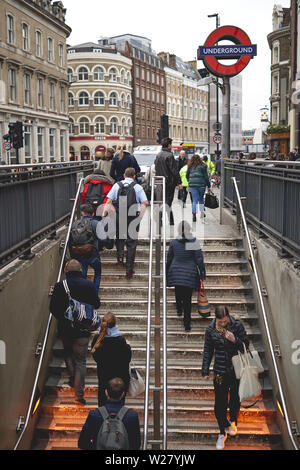 London, UK - April, 2019. Commuters and tourist exiting an underground station near London Bridge during rush hour. Stock Photo