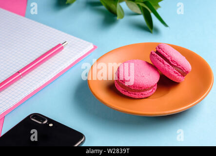 Coffee break in a colorful girly workspace Stock Photo