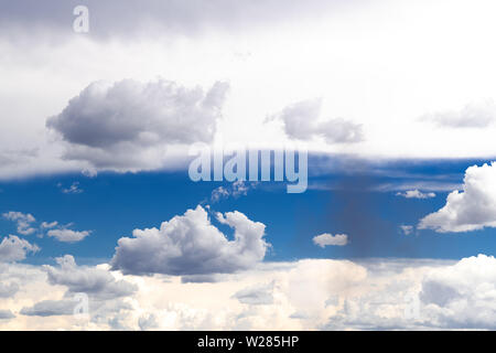 Cloudscape in the sky with blue and shades of gray Stock Photo