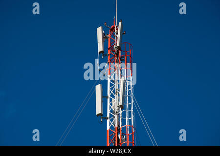 Telecommunications equipment - directional mobile phone antenna dishes. Wireless communication. Stock Photo