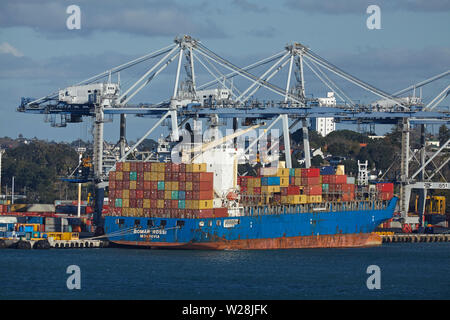 Bomar Rossi container ship and cranes at Ports of Auckland, Auckland, North Island, New Zealand Stock Photo