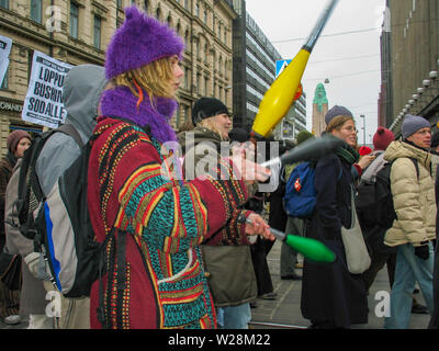 Helsinki, Finland - March 22, 2003: Anti-war protesters march through downtown Helsinki to protest the impending United States invasion of Iraq. Stock Photo