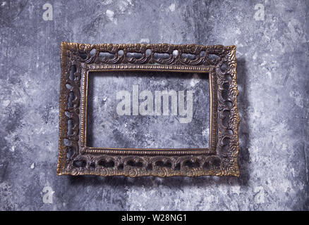 antique metal bronze frame on the gray background Stock Photo