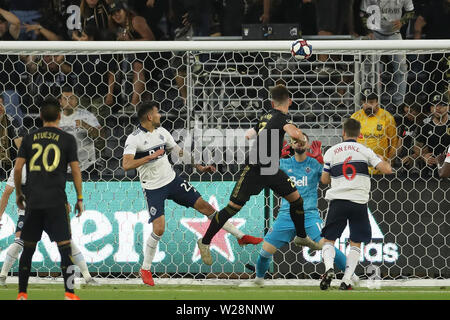 Los Angeles, CA, USA. 6th July, 2019. Vancouver gets some help from the goal crossbar to keep the shot out of goal during the game between Vancouver Whitecaps and Los Angeles FC at Banc of California Stadium in Los Angeles, CA., USA. (Photo by Peter Joneleit) Credit: csm/Alamy Live News Stock Photo
