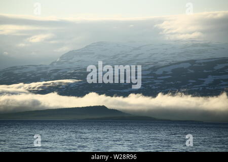 Clouds creeping over hills at the Tornetrask in Sweden. Stock Photo