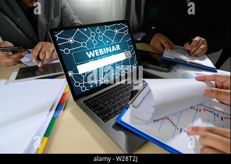 WEBINAR man hand on table Business, coffee, Split tone WEBINAR phone Stock Photo