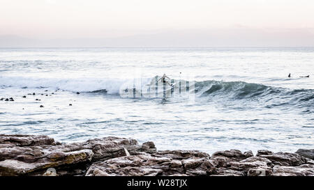 Surfing Danger Reef in the Cape Town False Bay suburb of St James on South Africa's Atlantic coastline Stock Photo