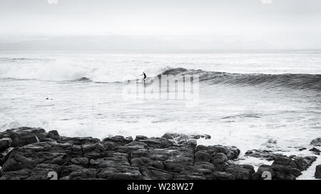 Surfing Danger Reef in the Cape Town False Bay suburb of St James on South Africa's Atlantic coastline Stock Photo