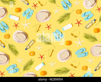 Beach concept - seamless pattern of beach accessories on yellow background Stock Photo