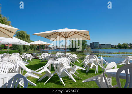 Berlare, Belgium, 29 June 2019, couple sits alone on an empty terrace Stock Photo