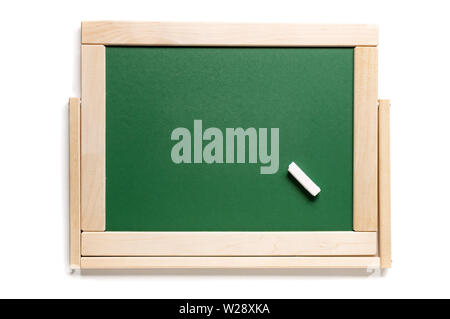 A piece of white chalk on the background of the school green board. View from above. Place for text. Stock Photo