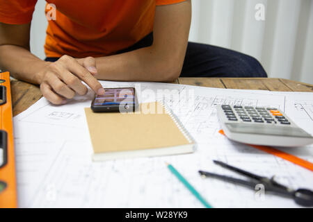 Architect Designing in blueprint at Construction Site With drawing equipment.concept Stock Photo