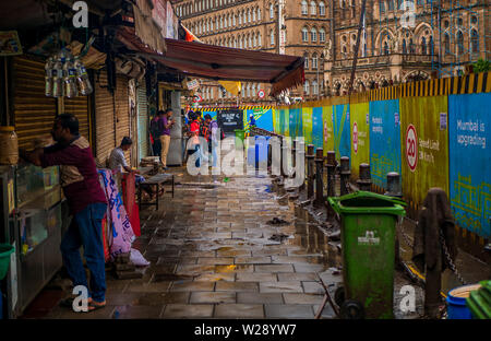 Mumbai, India - June 30, 2019 : Unidentified people eating breakfast at street food stall outside CST station in mumbai Stock Photo