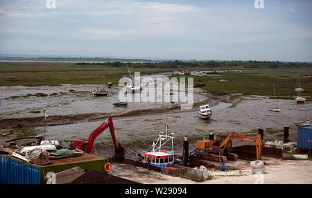 Construction work on the mud at low tide on the Thames Estuary, Old Leigh, Leigh-on-Sea, Essex, England, United Kingdom Stock Photo