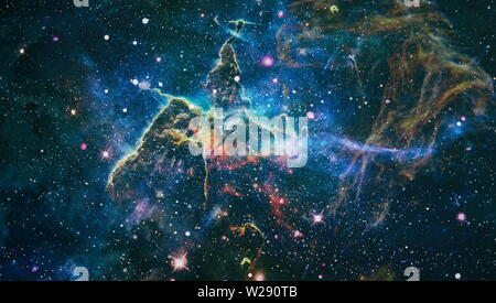 Giant glowing nebula. Space background with red nebula and stars. Elements of this image furnished by NASA. Stock Photo