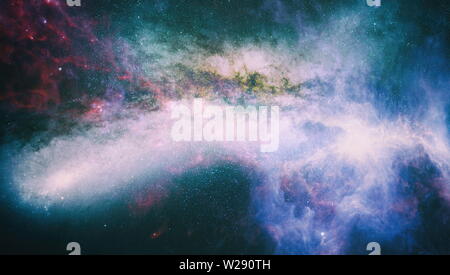 Giant glowing nebula. Space background with red nebula and stars. Elements of this image furnished by NASA. Stock Photo