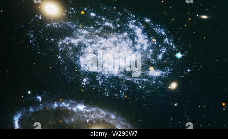 Giant glowing nebula. Space background with red nebula and stars. Elements of this image furnished by NASA. Stock Photo