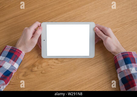Man holding digital tablet device with white blank screen - mockup image Stock Photo