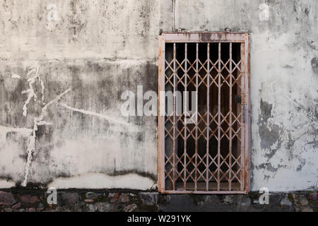 Old wrought iron doors on gray cement floor for background. Stock Photo