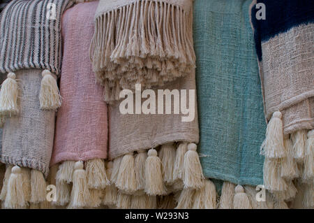 Close up picture of some pastel colored beautiful bohemian style rugs , located at the famous Love Anchor Market in Canggu, Bali - Indonesia Stock Photo