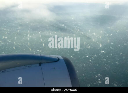 The Netherlands, 7 Feb 2019: Aerial photograph taken from a passenger aircraft of a large offshore wind farm in the North Sea close to the Dutch coast Stock Photo