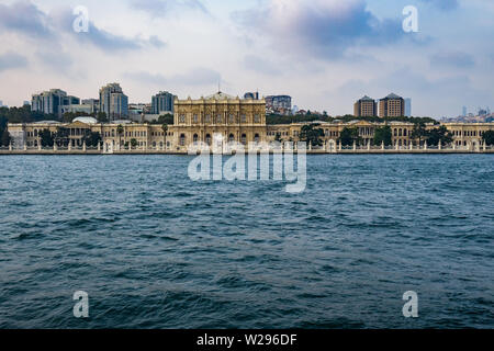 Dolmabahce palace seen from a ferry boat cruising the Bosphorus strait, Istanbul, Turkey Stock Photo