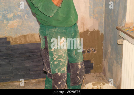 Tiler install ceramic retro straps clinker tiles Stock Photo