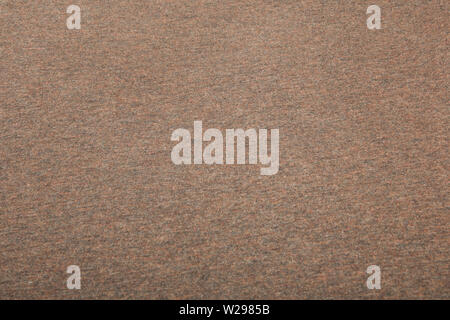 Background with brown texture, velvet fabric, full frame, close-up. Can be used as background, wallpaper. Stock Photo