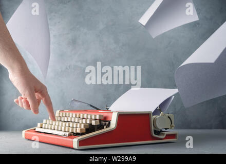 Typewriter on the table and sheets of paper Stock Photo