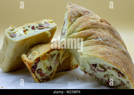 Naples. Il Casatiello a pizza stuffed with ham, cheese, eggs, salami, pepper. Stock Photo