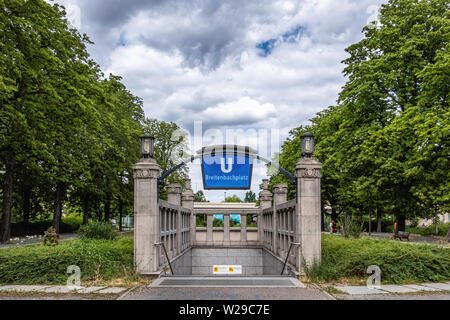 Berlin Dahlem District,Breitenbachplatz U-Bahn underground railway station entrance with old stone pillars, lamps & blue station name. Stock Photo