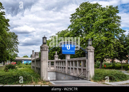 Berlin Dahlem District,Breitenbachplatz U-Bahn underground railway station entrance with old stone pillars, lamps & blue station name. Stock Photo