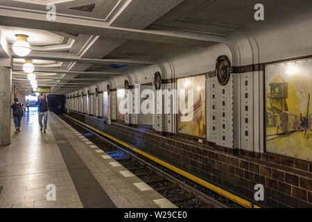 Berlin Dahlem District,Breitenbachplatz U-Bahn underground railway station interior, Platform, decorative tiles, medallions & old paintings. Stock Photo