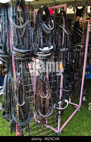 90th Kent County Show, Detling, 6th July 2019. Bridles hanging up on a display rack. Stock Photo