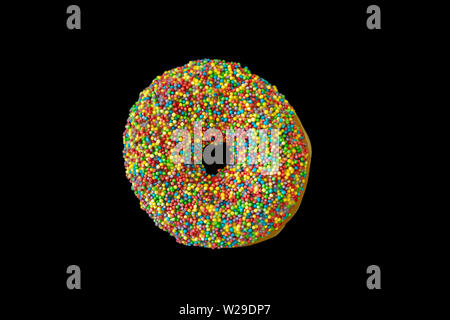 Multicolor donut. One donut with colorful decoration isolated on black color background. Top view Stock Photo