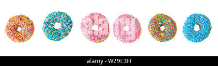 Assorted donuts. Colorful donut collage isolated cutout on white color background. Top view, banner Stock Photo