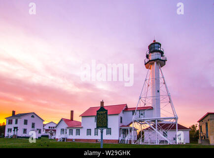 Lighthouse Sunset. Beautiful sunset at the Whitefish Point Lighthouse on the coast of Lake Superior in the Upper Peninsula of Michigan Stock Photo