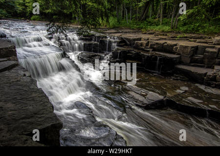 Scenic Michigan Waterfall Landscape. Beautiful Quartzite Falls flows through a gorge on the Slate River in the Upper Peninsula County of Baraga Stock Photo