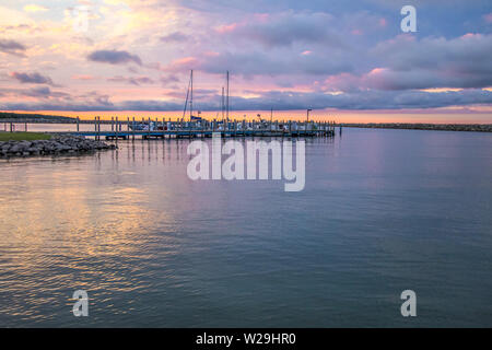 Sailing Sunset Sky Background.. Michigan marina along the Great Lakes coast with a beautiful sunset sky. Cheboygan, Michigan Stock Photo