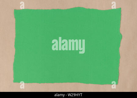 green color piece of torn paper on recycled paper background texture Stock Photo