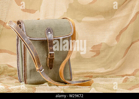 Old vintage canvas bag with leather strap Stock Photo