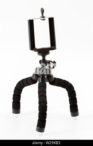 Mini tripod for smartphone on a white background Stock Photo