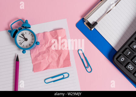Paper sheet note clipboard pencil clips calculator clock colored background Stock Photo