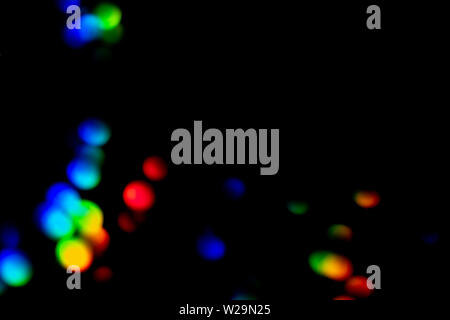 Rainbow overlays isolated on black background. Creative defocused bokeh lights, colorful elements artwork design idea Stock Photo