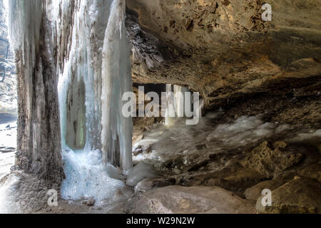 Ice formation in grotto cave during the winter at Hocking Hills State Park in southeast Ohio USA. Stock Photo