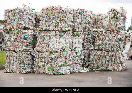 Minsk, Belarus -June 6, 2019 Pile of pressed white plastic bottles at a garbage collection plant. Stock Photo